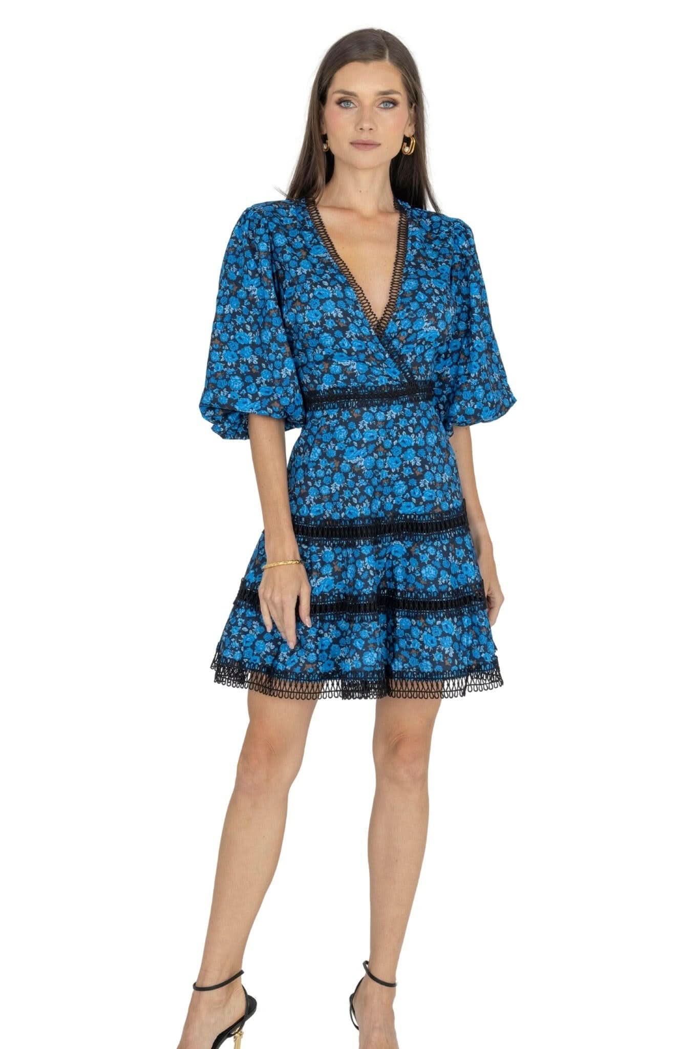 Blue floral tiered mini dress with V-neck, puff sleeves, and black trim