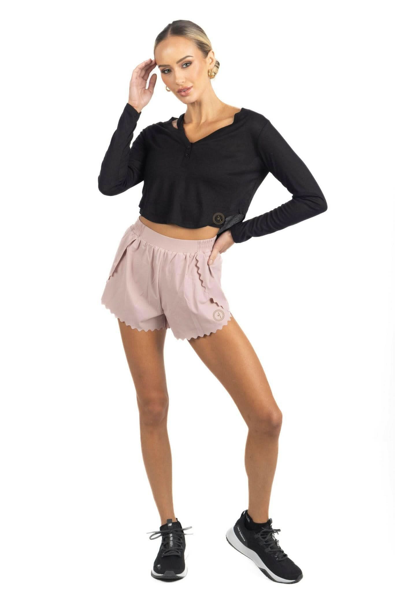 Black long-sleeve cropped top with V-neck and button-front placket