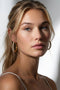 Gold-tone crystal hoop earrings with small posts
