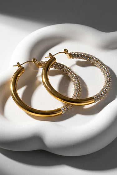 Gold-tone crystal hoop earrings with rhinestone sparkle, pair