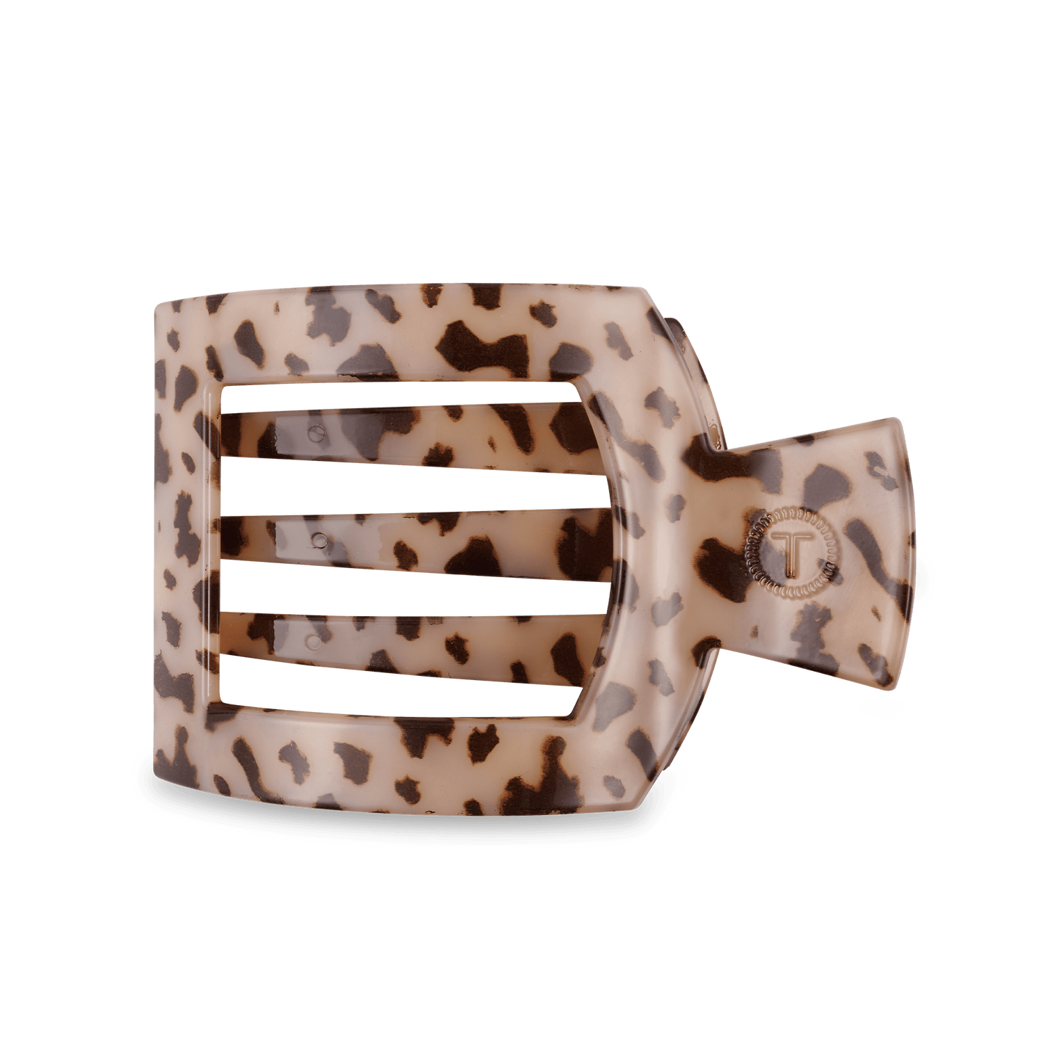 Large flat square hair clip in blonde tortoise pattern with metal T emblem