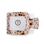 Blonde tortoise square hair clip with T logo, shown from the reverse side