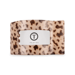 Medium flat rectangle hair clip with beige tortoise-speckled design and center logo panel