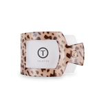Flat square tortoise hair clip showing Teleties logo plate on beige leopard base.