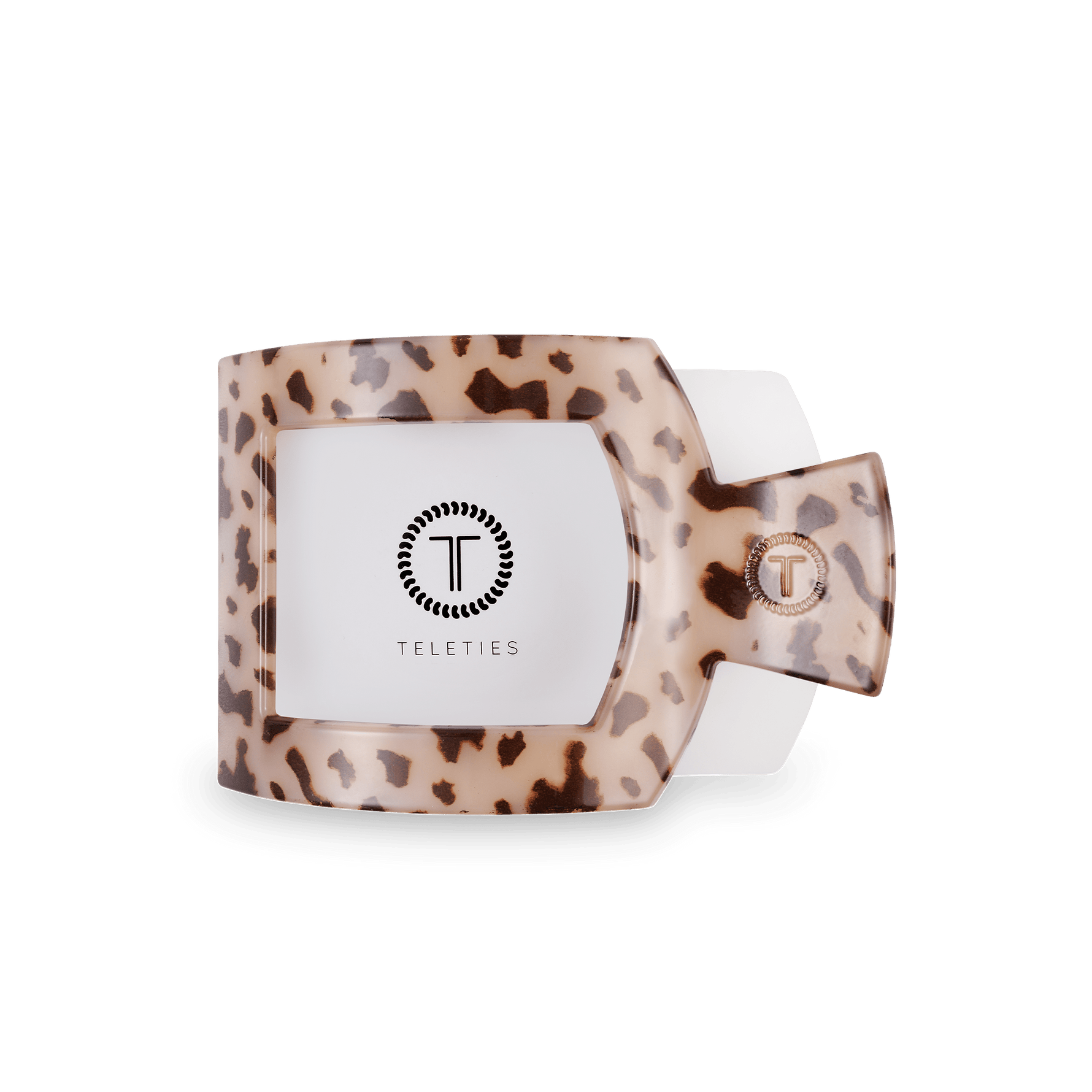 Flat square tortoise hair clip showing Teleties logo plate on beige leopard base.