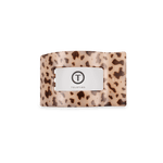 Small flat rectangle hair clip with blonde tortoise pattern and centered logo plate