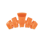 Small orange claw hair clip with three prongs