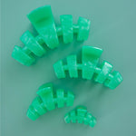 Set of mint green claw clips arranged in a circle