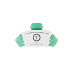 Mint green claw clip in package with slide-in prongs