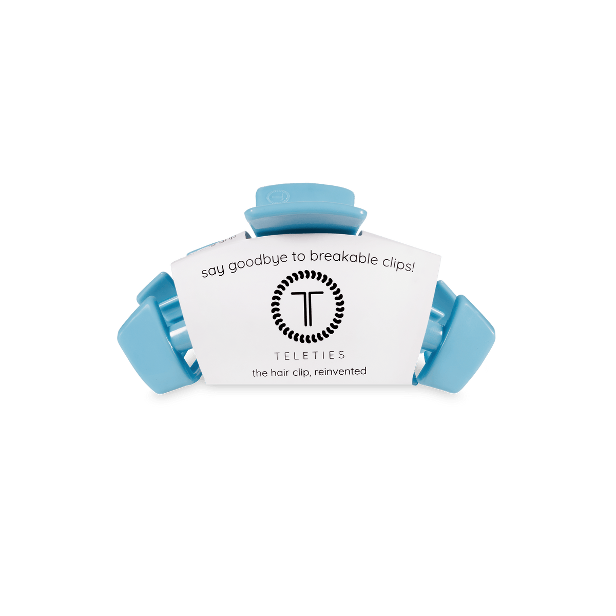 Sky-blue claw hair clip holding a small product label card