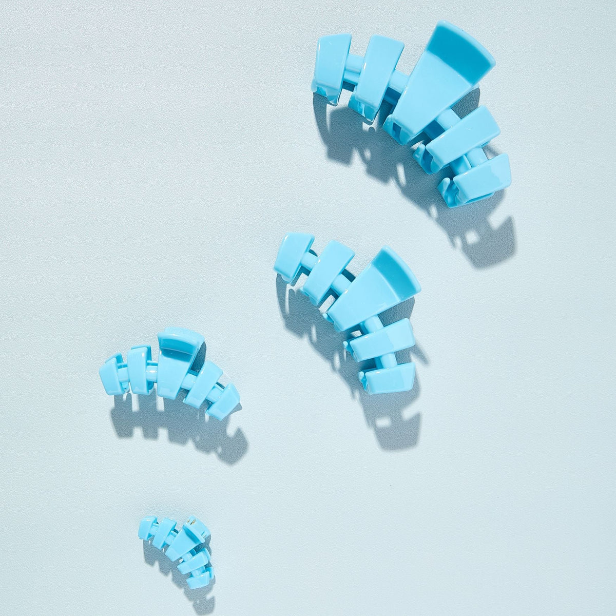 Sky-blue claw clips set of four shown from multiple angles