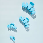 Sky-blue claw clips set of four shown from multiple angles