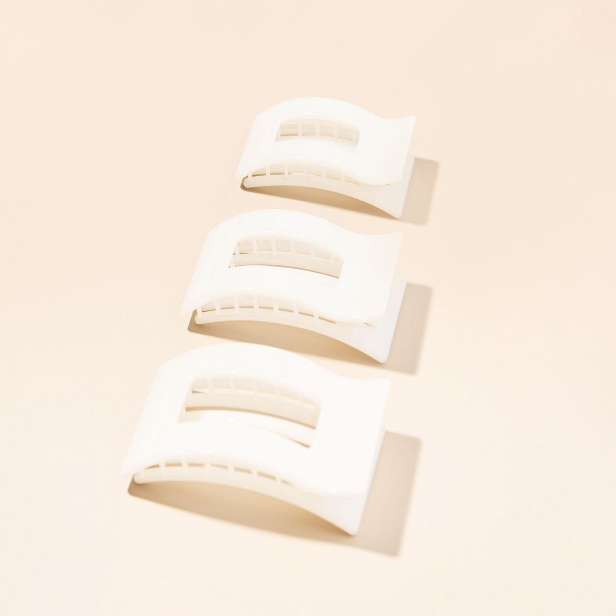 Set of large flat rectangle coconut white hair clips, three stacked