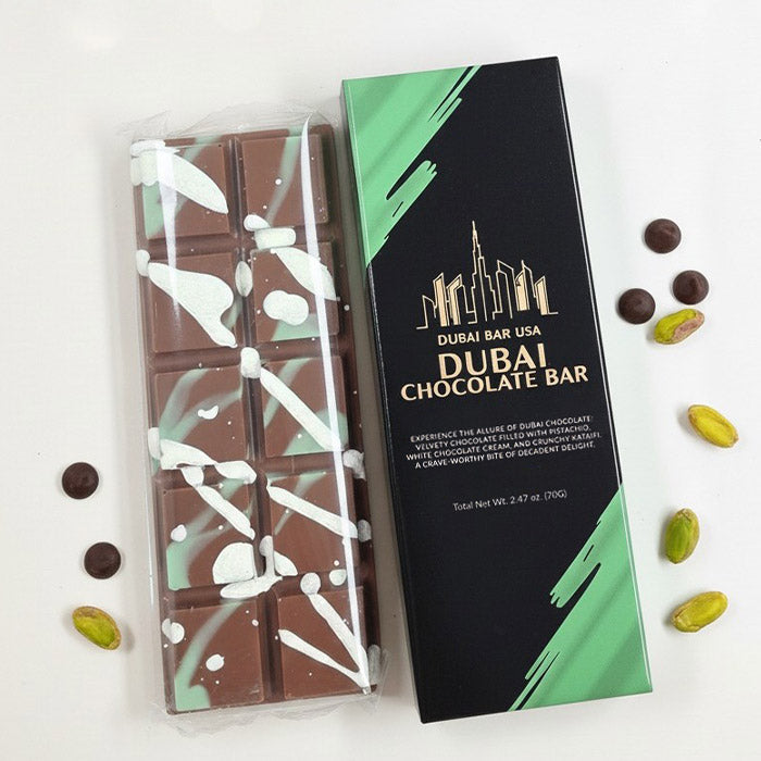 Dubai chocolate bar packaging with a wrapped chocolate bar and scattered cocoa bits