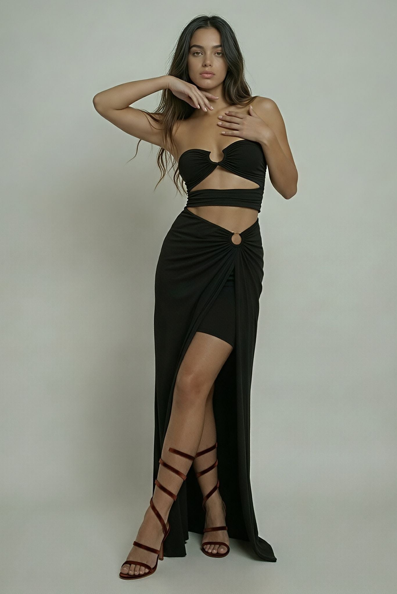 Black slit dress with sweetheart bandeau and ruched twist front