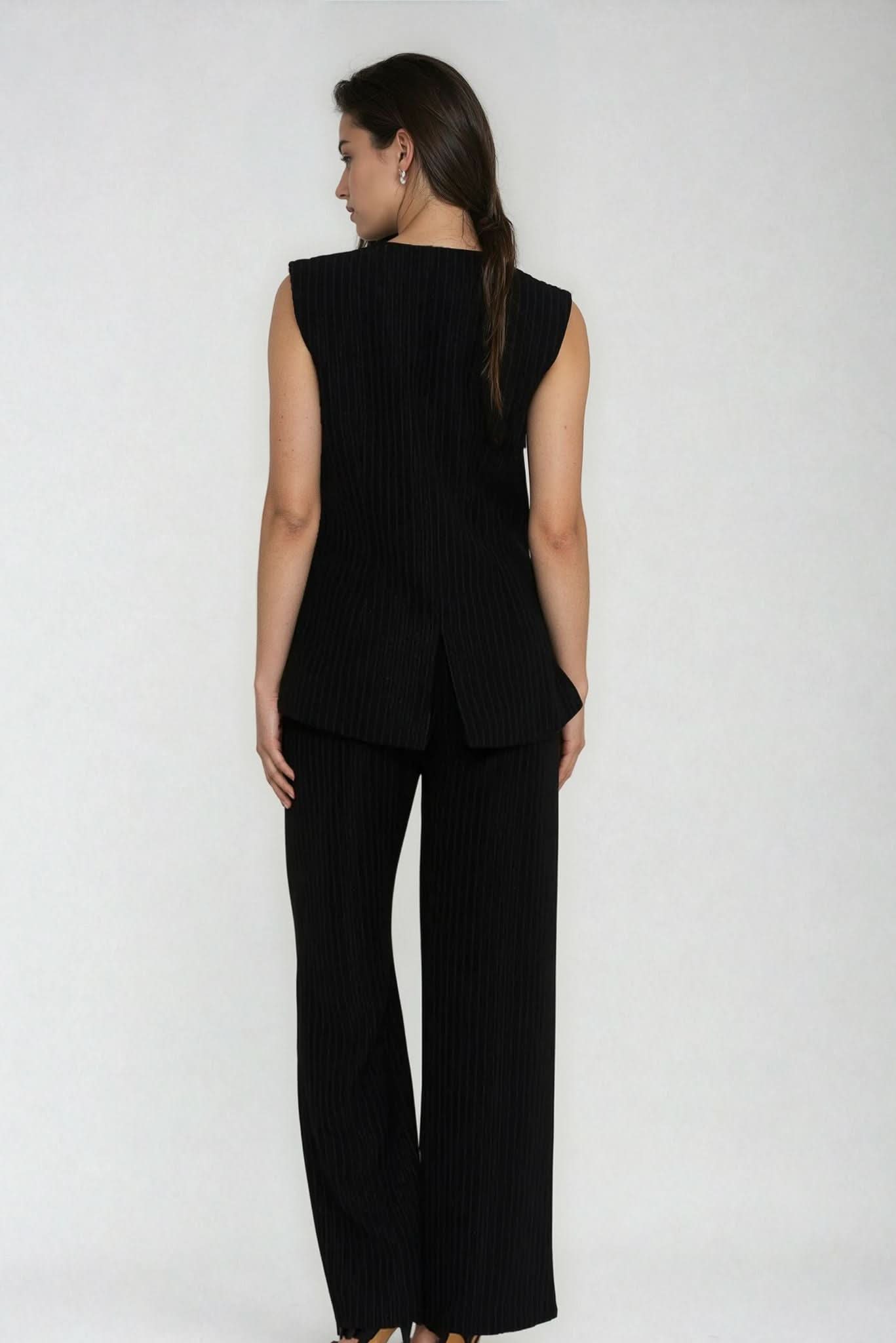 Black pinstripe wide-leg trousers with vertical stripe texture, back view