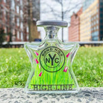 Bond No.9 eau de parfum bottle with green-tinted glass and silver cap
