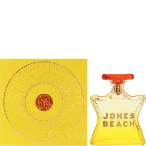 Eau de parfum bottle with red cap and 'JONES BEACH' label next to yellow box