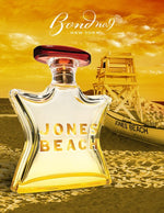Eau de parfum bottle with red cap, clear glass, and 'JONES BEACH' label