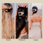 Jet black square flat hair clip securing hair, shown in multiple sizes