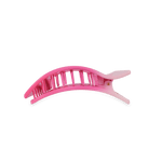 Pink plastic claw hair clip with ridged teeth for holding hair