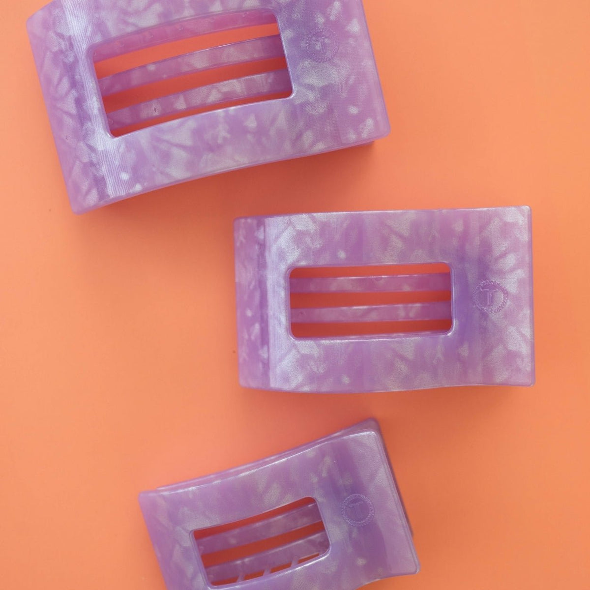 Set of lavender rectangular flat hair clips with marbled finish, each with bar slots
