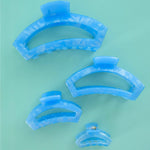 Set of tiny light blue translucent open hair clips