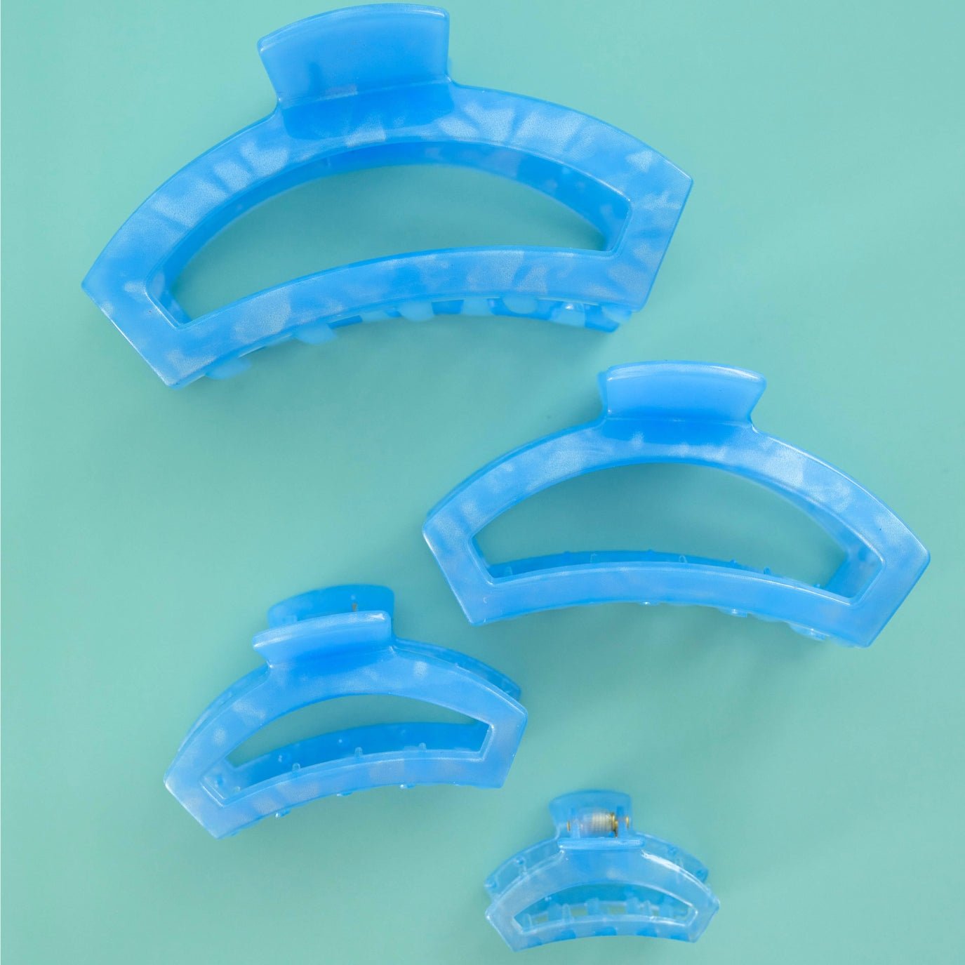 Set of tiny light blue translucent open hair clips