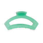 Medium hair clip in mint green with curved clamp teeth