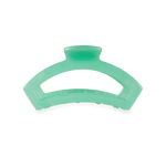 Small translucent green hair clip with spring-shape grip