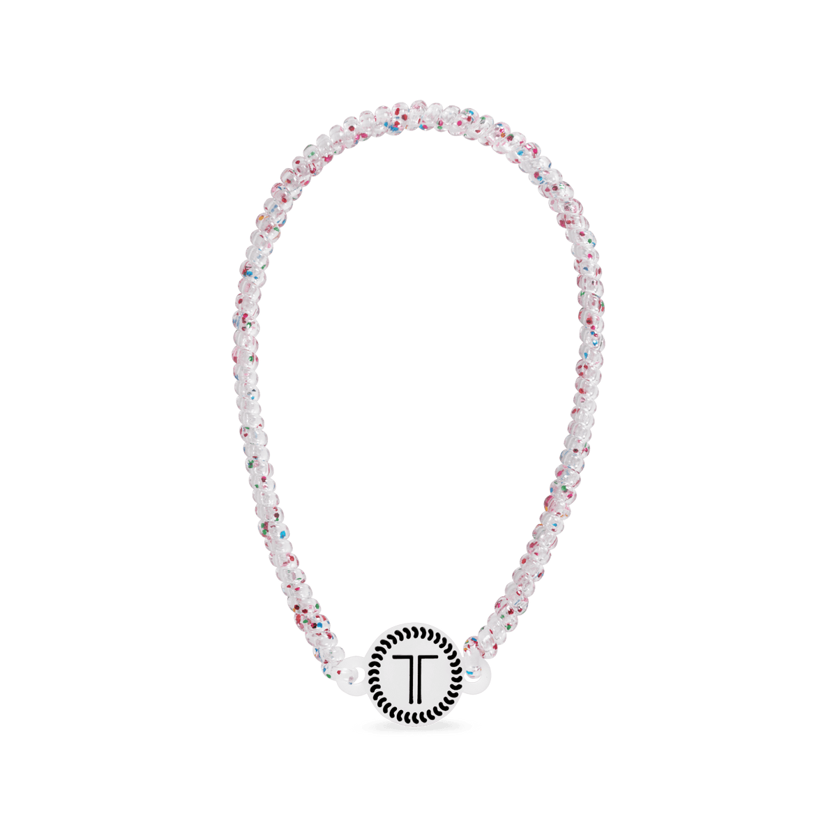 White beaded headband with rhinestone flowers and a round logo charm at front
