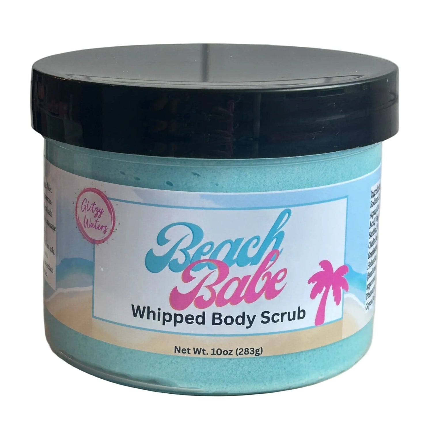 Teal whipped body scrub in clear tub with black lid, blue-and-pink palm label