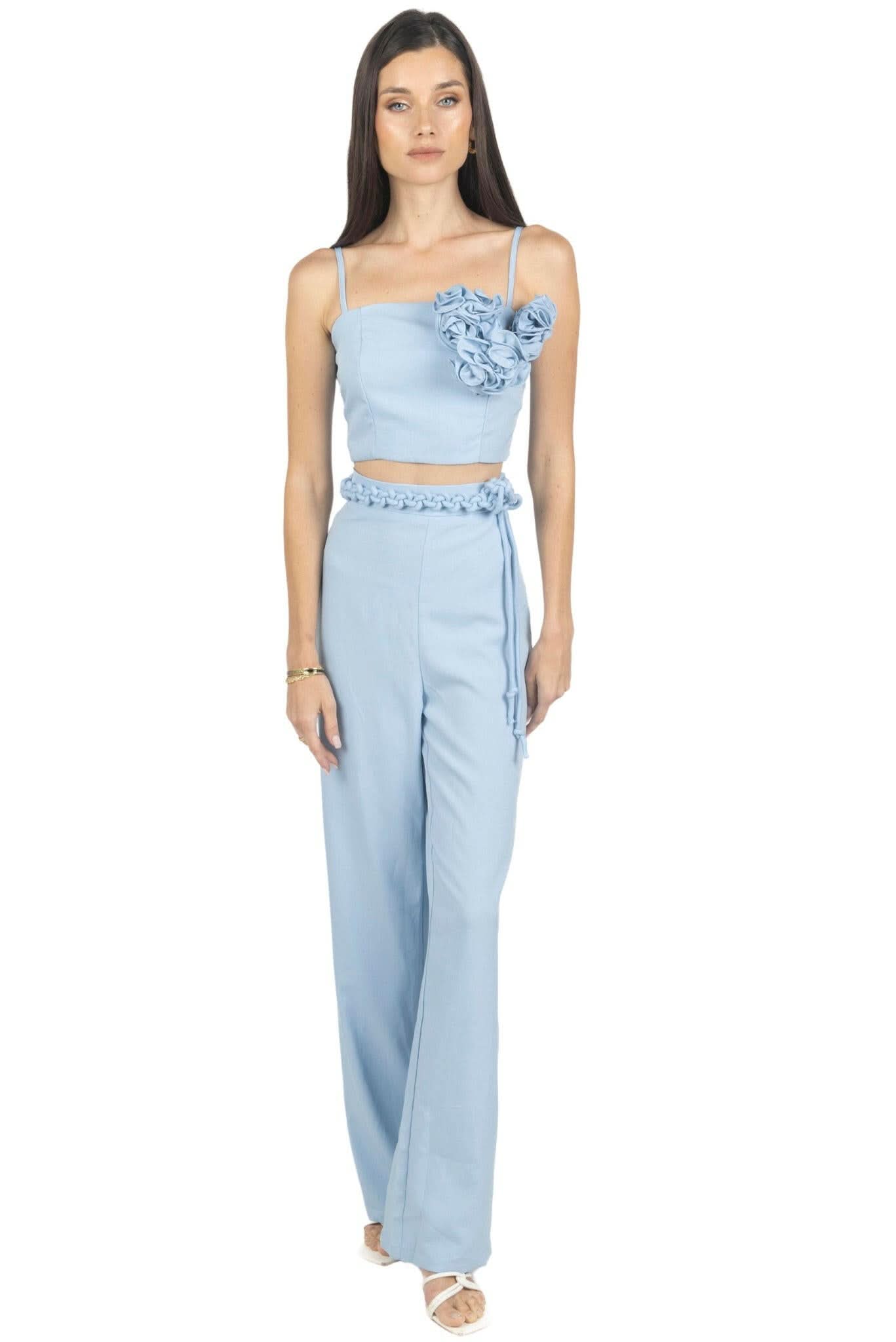 Light blue two-piece pants and cami top set with rosette detail at chest