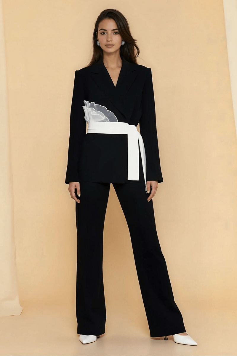 Dark blazer suit with white ribbon belt and V-neck, flared straight pants
