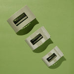 Set of large flat rectangle hair clips in sage green, three-pack view
