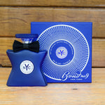 Bond No. 9 eau de parfum bottle with black bow and blue glass, beside matching box