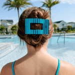 Teal striped large flat rectangle hair clip holding dark brown hair back