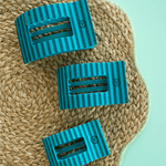 Set of medium flat rectangle hair clips, striped teal with grip teeth