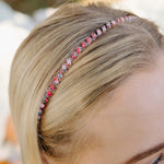 Beaded headband worn on blonde hair, pink and blue beaded pattern