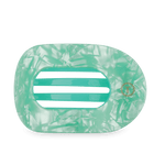 Large flat round hair clip, translucent mint green with marbled texture and striped slots