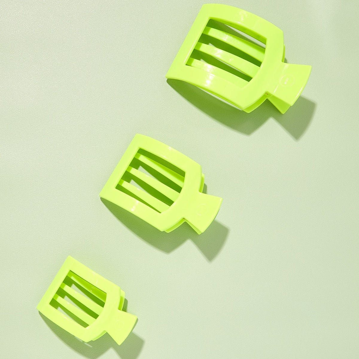 Set of three neon lime flat square hair clips with ridged center