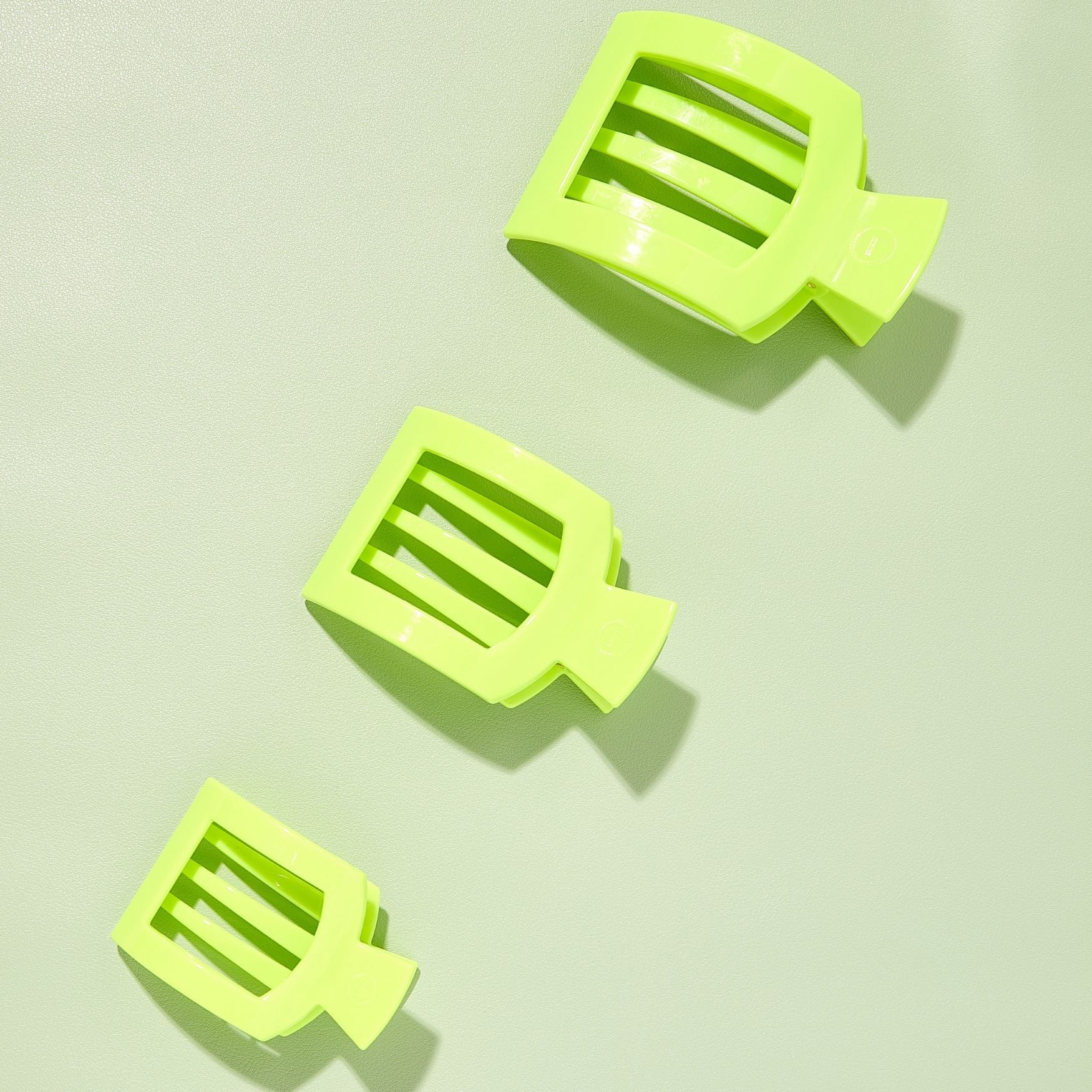 Set of three neon lime flat square hair clips with ridged center