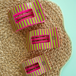 Three medium flat rectangle hair clips on straw hat; pink and green striped designs