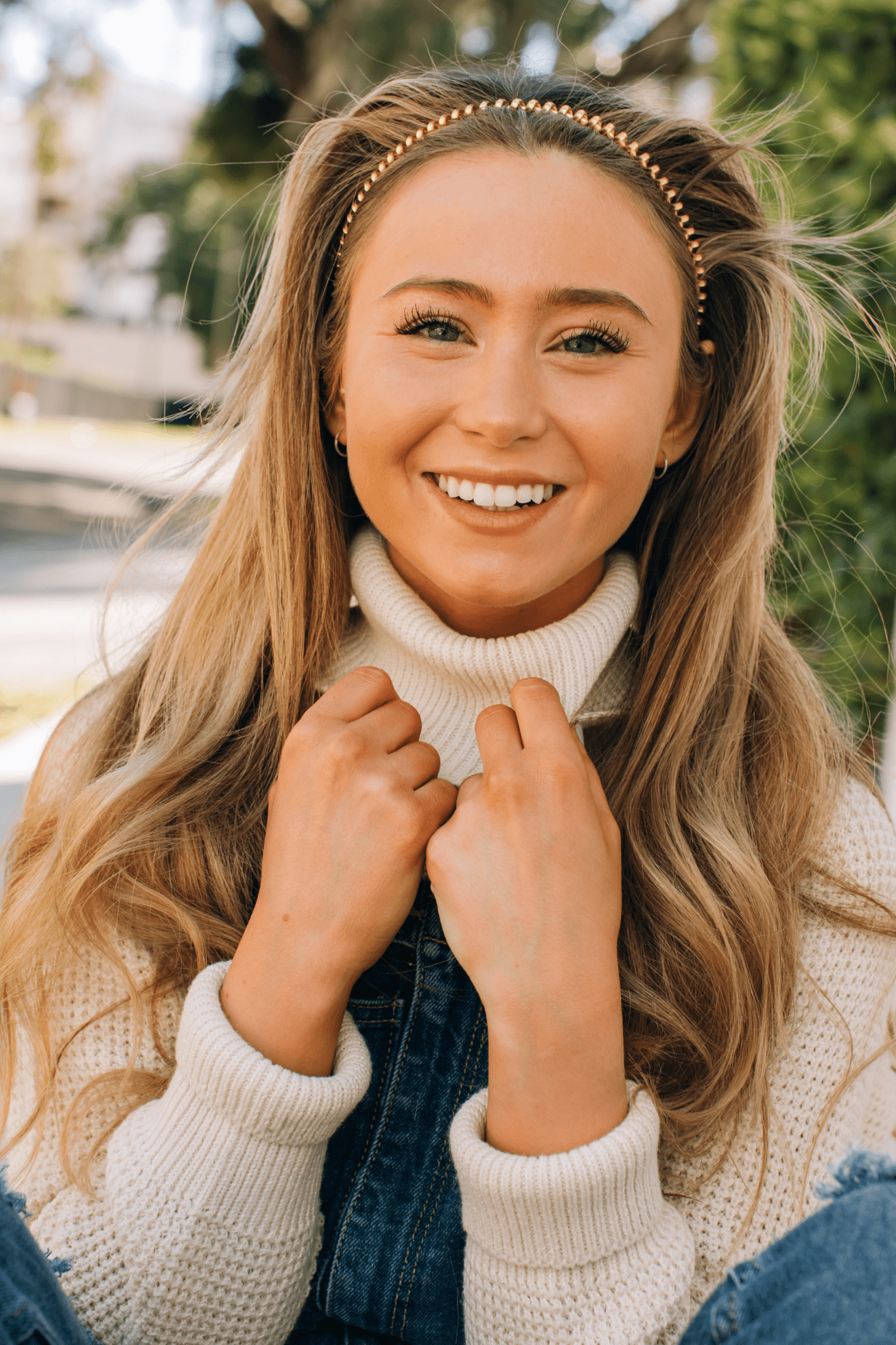 Gold-tone beaded headband worn across long blonde hair