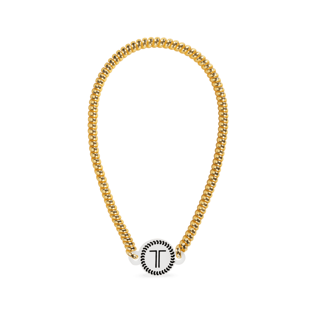 Gold-tone beaded headband with round logo charm at front