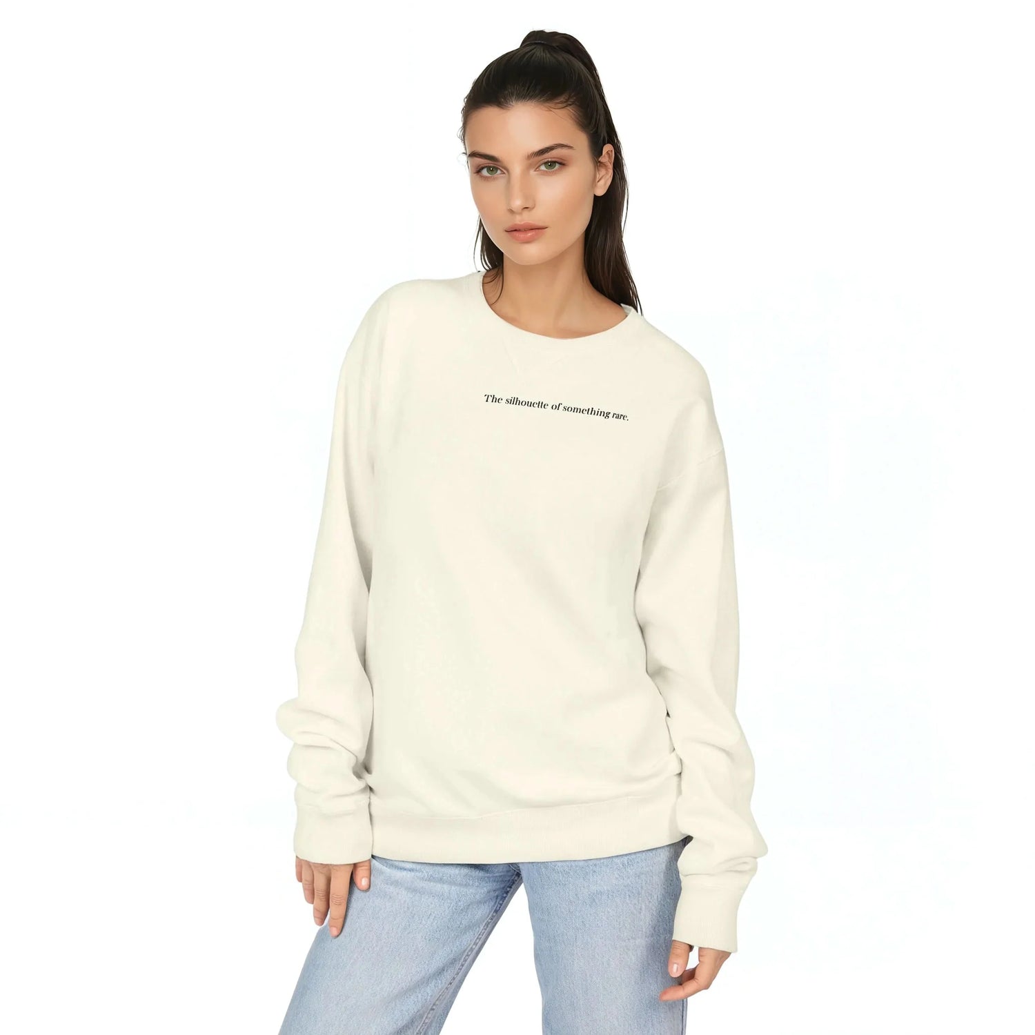 Cream crewneck sweatshirt with long sleeves and ribbed cuffs, small chest slogan