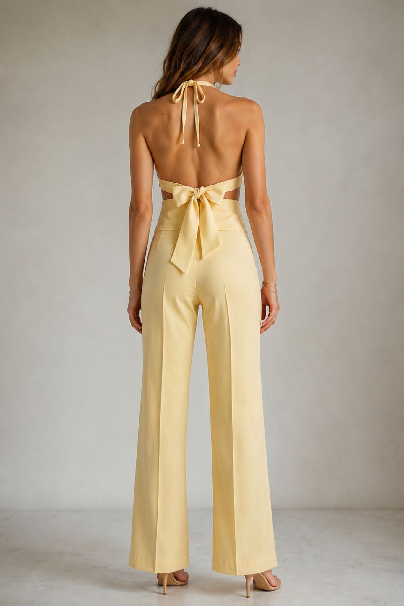 High-waisted wide-leg trousers in pale yellow with back tie detail