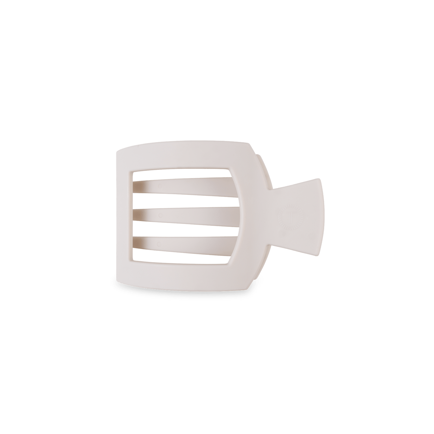 Small flat square hair clip in cream, with open cutout center and prong teeth