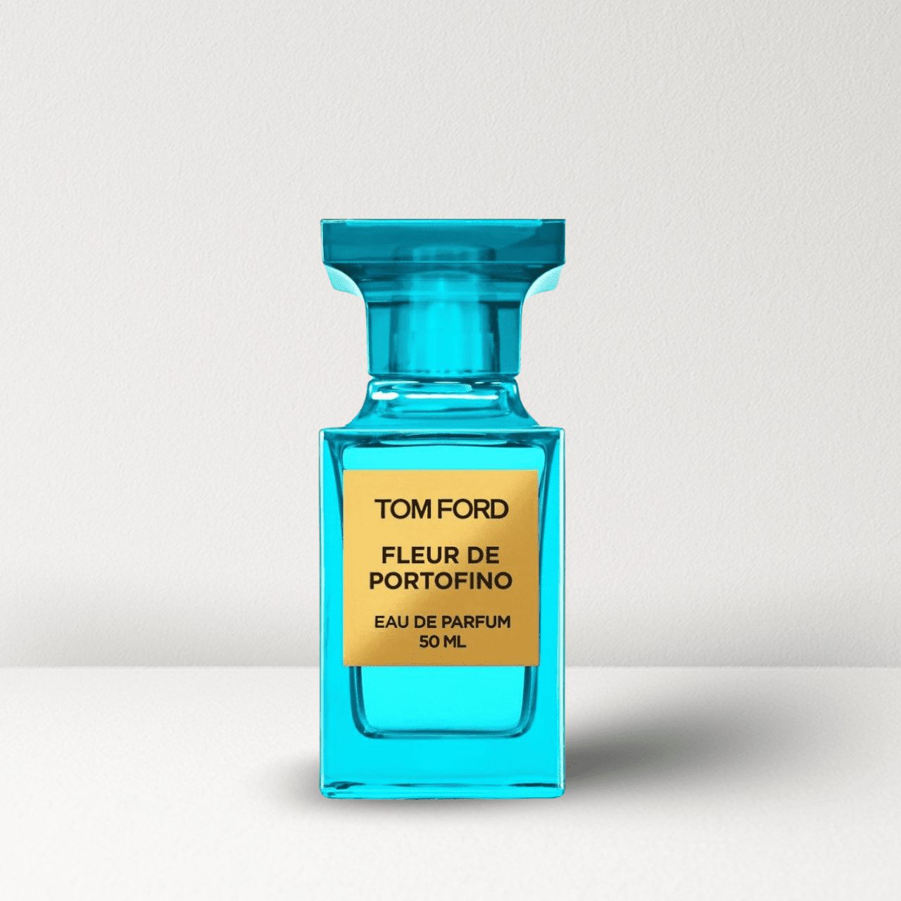 Teal glass eau de parfum bottle with gold label, Fleur de Portofino 50 ml