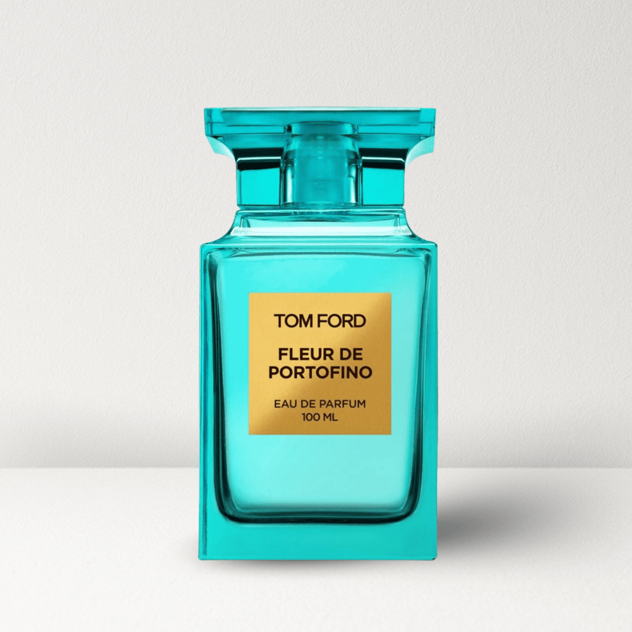 Teal glass eau de parfum bottle with gold label, Fleur de Portofino 100 ml